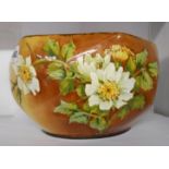 A Doulton Lambeth Faience faceted bowl decorated all around with barbatine dog roses