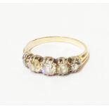 An antique high carat five stone old cut diamond ring