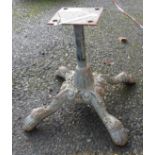 A small cast metal stand