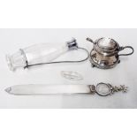 A silver mustard pot, silver mounted glass vinegar jug and a white metal paper knife with coin set