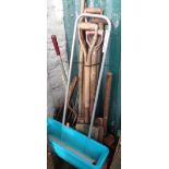 A bundle of assorted garden tools including spades, forks, rakes, hoes, etc.