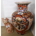 A large Japanese Imari baluster vase - sold with an oriental cat figure (repaired)