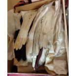 A box containing assorted gloves including evening and kid, stretchers, etc.