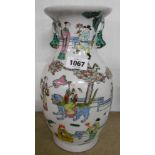 A 20th Century Chinese famille verte baluster vase decorated with figures in various poses