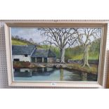 A framed vintage oil on board textured painting, depicting buildings and trees around a body of