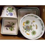 A box containing Portmeirion Botanic Garden dishes, trays, and bowls