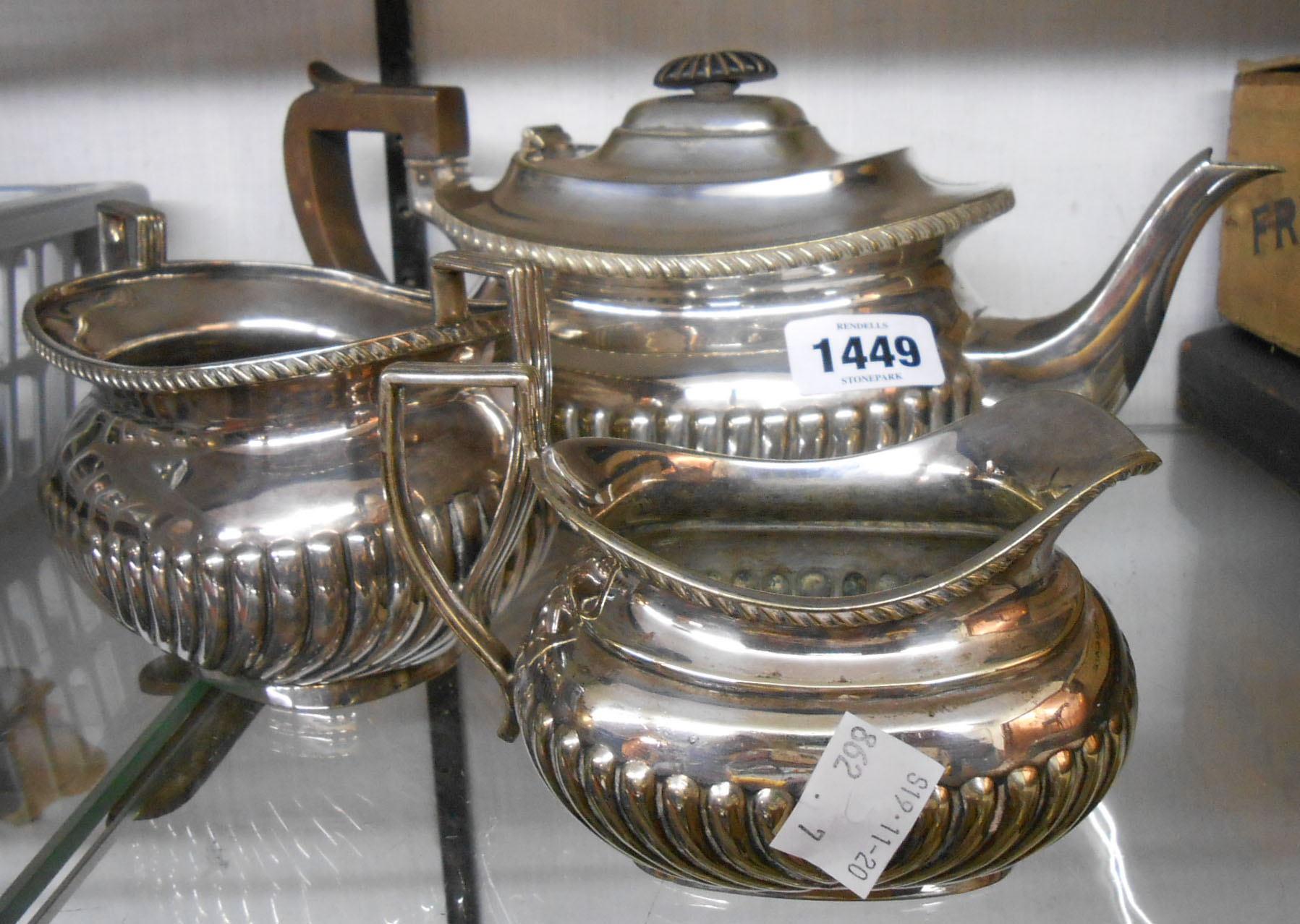 A silver plated three piece tea set of semi reeded oval design