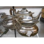 A silver plated three piece tea set of semi reeded oval design