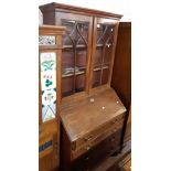 A 99cm 19th Century mahogany bureau/bookcase the later glazed top with Gothic beaded doors over a