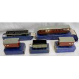 Five boxed vintage Hornby Dublo rolling stock items comprising Suburban Coach 1st/3rd B.R. 32090,