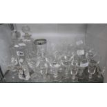 Assorted glassware including cut glass spirit decanter, Edinburgh Crystal clock, drinking glasses,