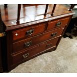 A 1.05m Edwardian walnut chest of two short and two long graduated drawers, set on bracket feet -