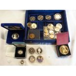 A coin case containing a collection of encapsulated silver proof commemorative and other coinage