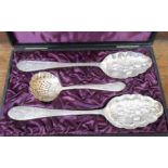 A cased pair of silver plated berry spoons and matching sifter ladle