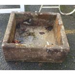 A square stone trough