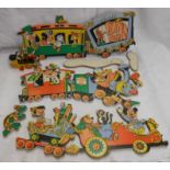 A vintage Disney wooden block puzzle of a train full of characters - sold with a Disney toy car