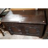 A 104cm 18th Century oak coffer with decorative arcaded and carved two panel front, set on moulded