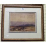 F.J. Widgery: a gilt framed watercolour, depicting a misty moorland view with tor in distance -