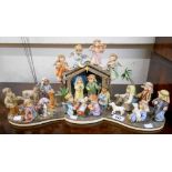 A Danbury Mint MJ Hummel modular Nativity scene comprising Come Let Us Adore Him, Holy Night,