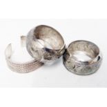 Two Anglo Indian white metal napkin rings with embossed horse and boss decoration - sold with a