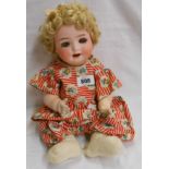 A small old German porcelain headed doll - marks covered by hair
