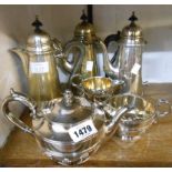 A silver plated three piece tea set with applied cast decoration - sold with two coffee pots (one