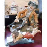 A Capodimonti figurine of a tramp by Cortese - sold with another of a child lying on a cushion