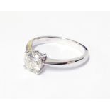 An import marked 750 white gold diamond solitaire ring - 1ct., boxed and with certificate