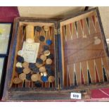 A tooled leather desk blotter - sold with a leather clad book pattern backgammon set - various
