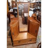 A 103cm wide Art Nouveau satin walnut well dressing table chest with central swing mirror flanked by