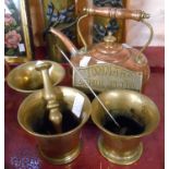 A copper kettle, three old brass mortars and a pestle, and a Registered Tonnage brass sign