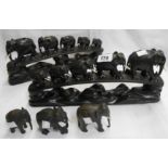 A pair of carved ebony elephant bridges - sold with three further carved ebony elephant models
