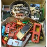 A box of assorted die cast and other toys