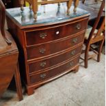 A 78cm reproduction mahogany bow front chest of four long drawers, set on bracket feet