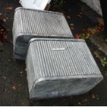 A large pair of modern galvanized planters
