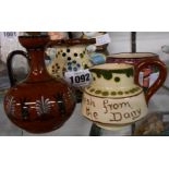 A Torquay pottery Aller Vale puzzle jug, a Watcombe Porcelain Classical urn, and two further pieces