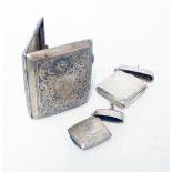 A silver cigarette case with initials to shield shaped cartouche, silver fob vesta case and an