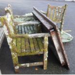 A Barlow Tyrie teak table and four chairs covered in lichen