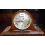 An early 20th Century mahogany cased Napoleon hat mantle clock with eight day chiming movement -