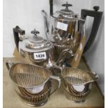 A vintage silver plated three piece tea set of semi-reeded oval design, the teapot with Powderham