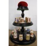 A Royal Crown Derby set of fifteen thimbles and stand