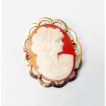 A hallmarked 9ct. gold framed oval cameo brooch