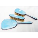 A 1930's enamel silver backed hand mirror and brush set - all with damage to enamel