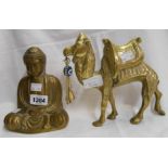 A brass buddha and camel