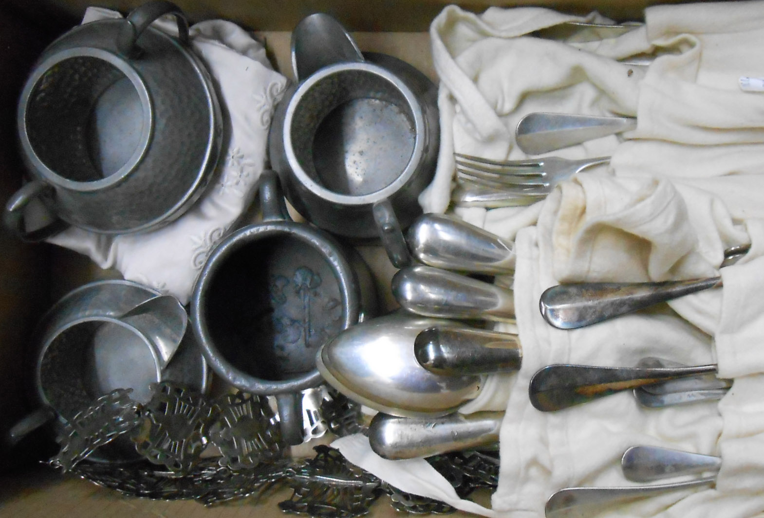 Various wraps containing assorted silver plated cutlery - sold with a silver plated nurse's belt and