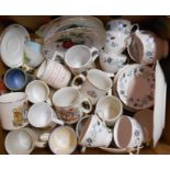 A box containing assorted ceramics including commemorative mugs, Colclough part tea set, etc.