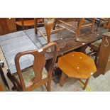 An antique rustic five plank top refectory dining table with drop ends, set on heavy shaped standard