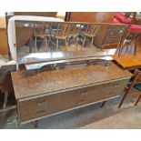 A 1.51m vintage formica faced dressing table with oblong mirror, shelf and six drawers, set on