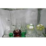 A selection of decorative coloured and other glassware including paperweights, vases, bowls, etc.