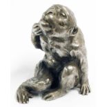 An old Japanese polished pewter figurine of a monkey - seal mark to base